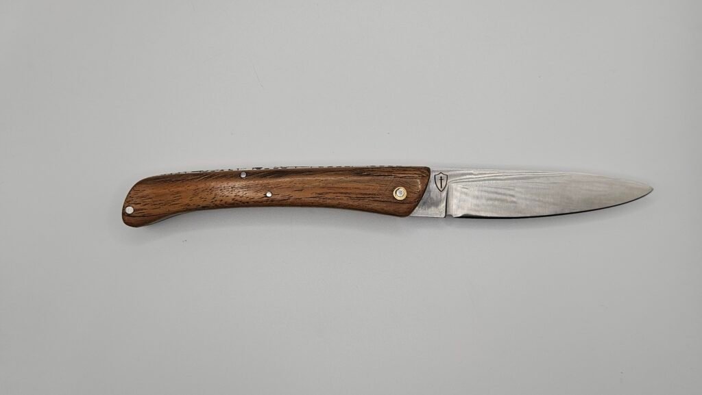 pliant artisanal cran forcé inox & Teck